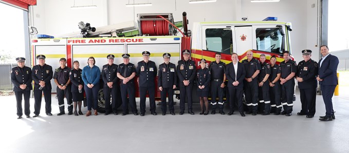 Image of Queensland Firefighters in front of a Fire Truck
